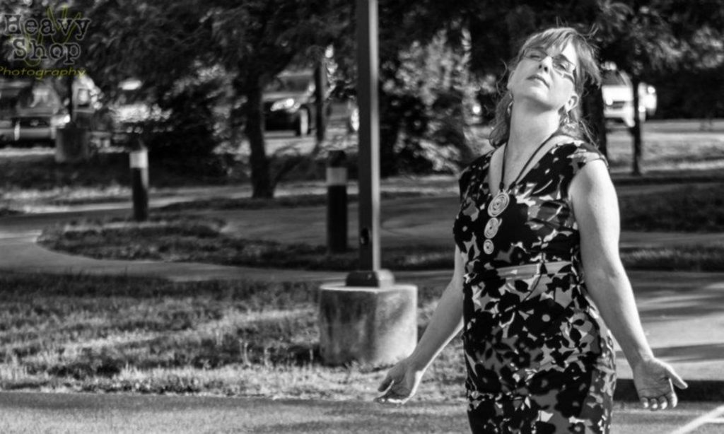 PJ Woodside in black and white, medium distance.